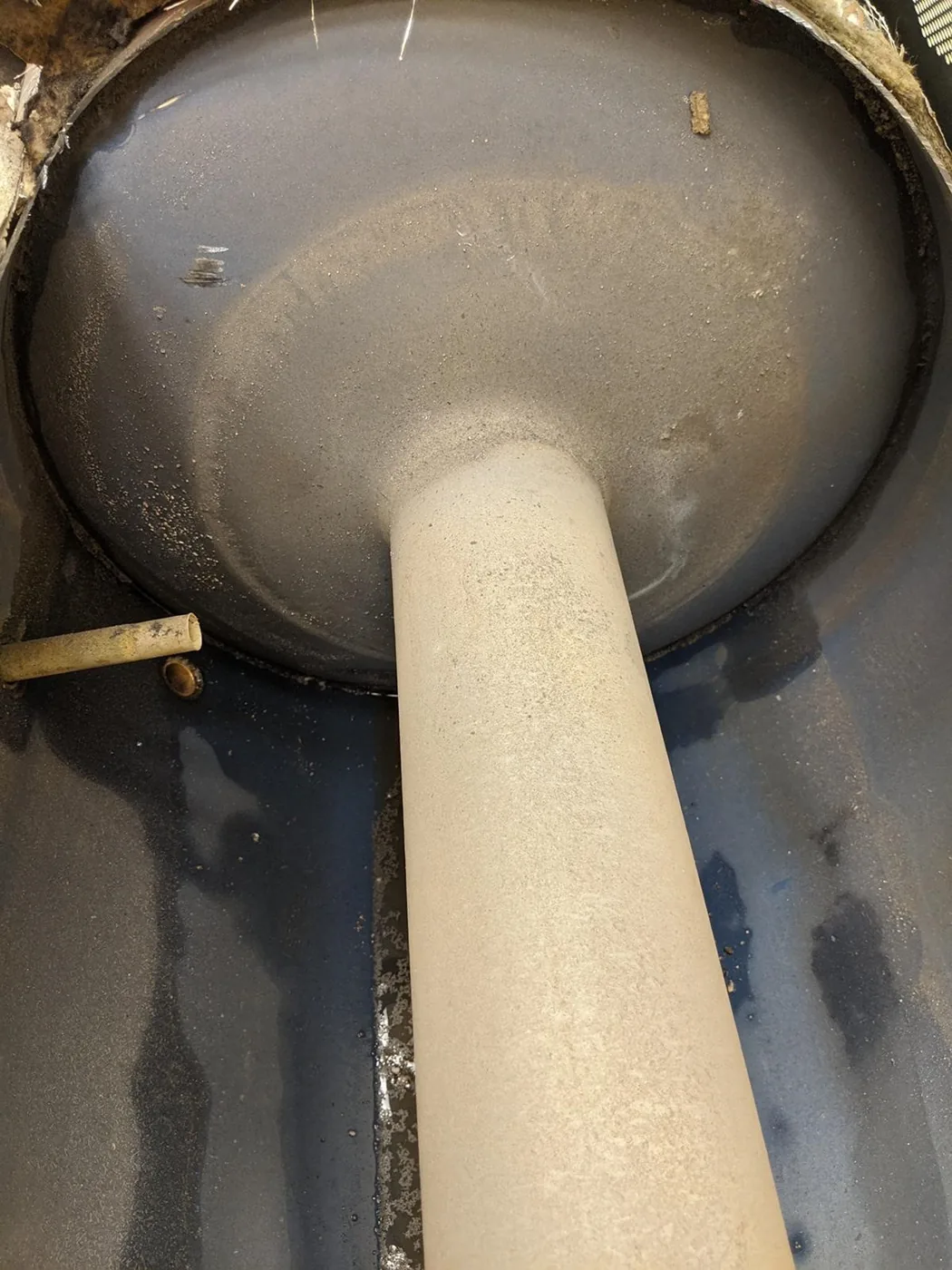 Water heater element from a USA field test after operating with IPS KalyxX installed, showing loose, easily removed deposits