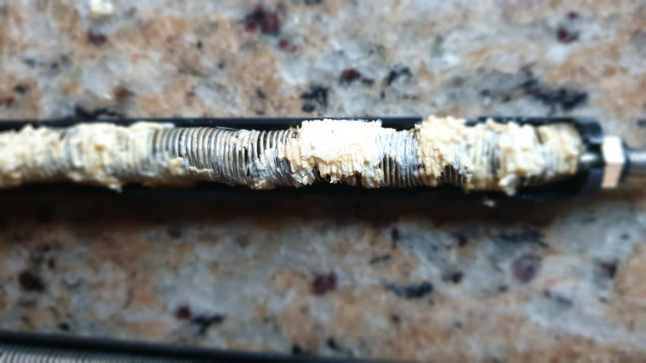 Heater coil covered in thick limescale deposits after six months without water treatment