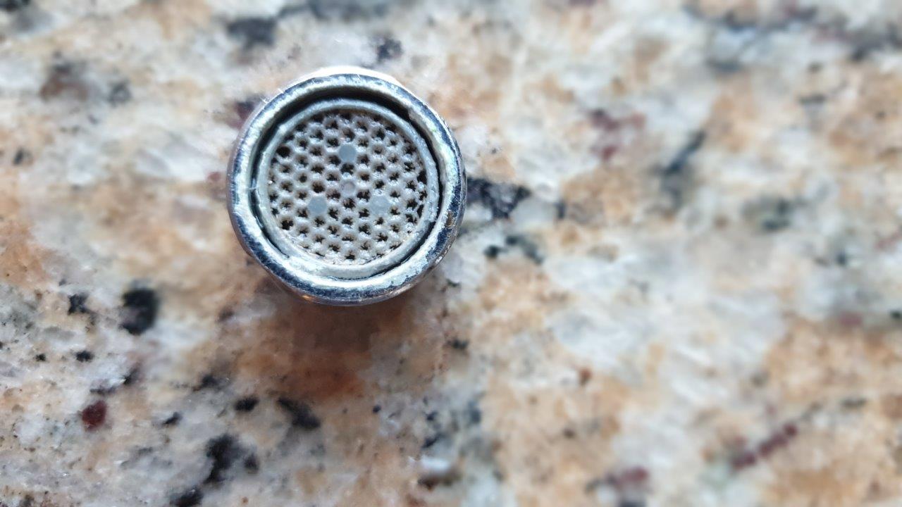 Tap outlet with scale build-up on a supply without an IPS installed